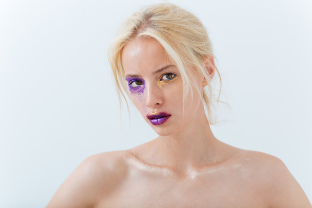 Portrait of beautiful young woman with stylish makeup - Fotó, kép