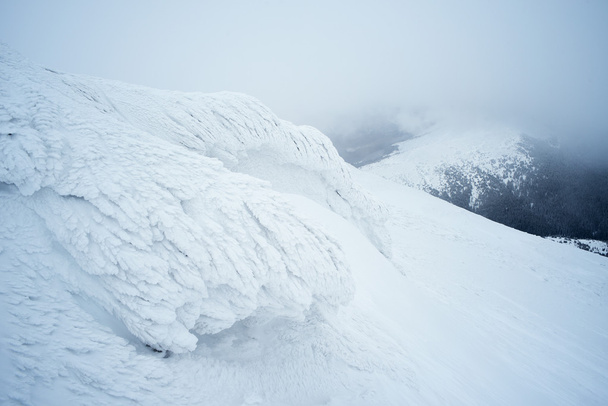 Winter landscape with hoarfrost on a rock - Φωτογραφία, εικόνα