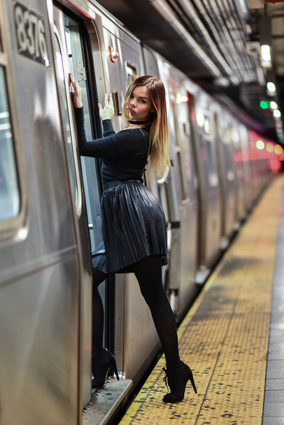 Sexy glamour woman posing at the train staion - Valokuva, kuva