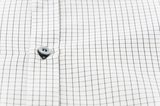 Close up button on shirt - Foto, afbeelding