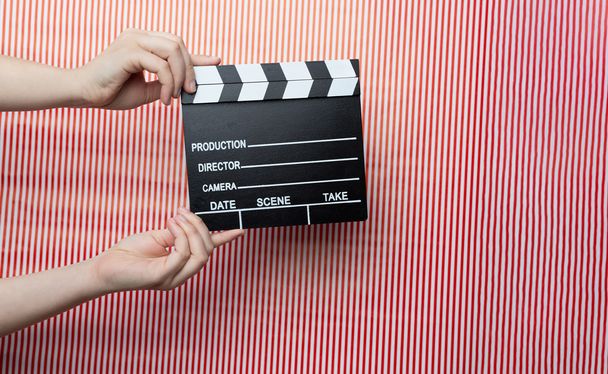 Woman holding movie clapper - Photo, Image