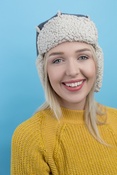 woman in a woolly winter hat with earflaps - Φωτογραφία, εικόνα