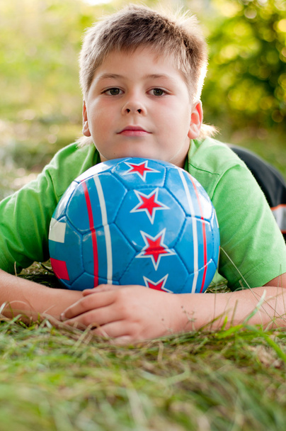 The boy with the ball on the nature - Photo, image