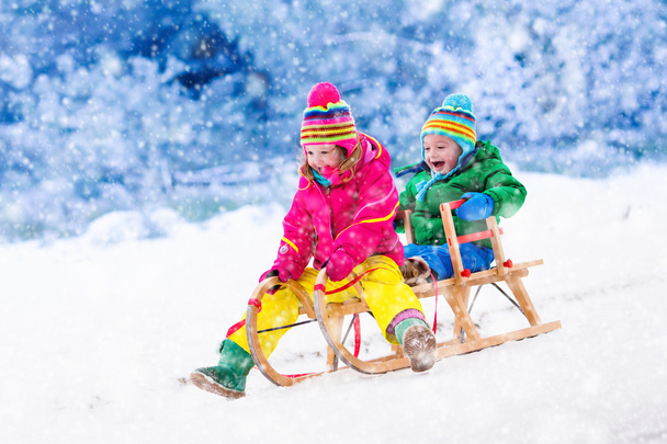 Kids having fun on sleigh ride - Zdjęcie, obraz