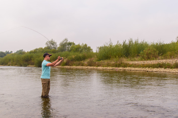 Slicc halászat a folyón - Fotó, kép