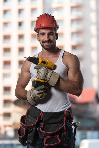 Portrait Of A Worker With Drill - Φωτογραφία, εικόνα