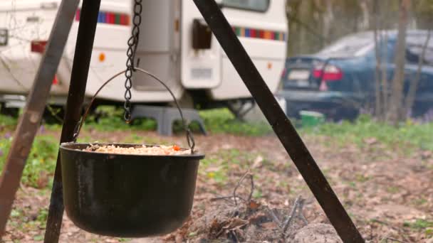4K shot.Life outdoors in caravan, trailer. Pilaf  close up in wood campfire - Footage, Video