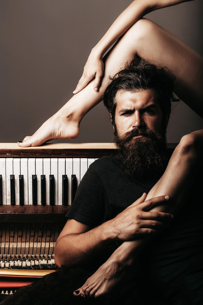 Bearded man with female legs - Zdjęcie, obraz