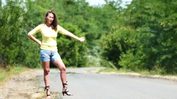  4K. Hot summer and  beautiful sexy woman stopping car  on  road. Hitchhiking team. 4K. Hot summer and  beautiful sexy woman stopping car  on  road. Hitchhiking team. - Footage, Video