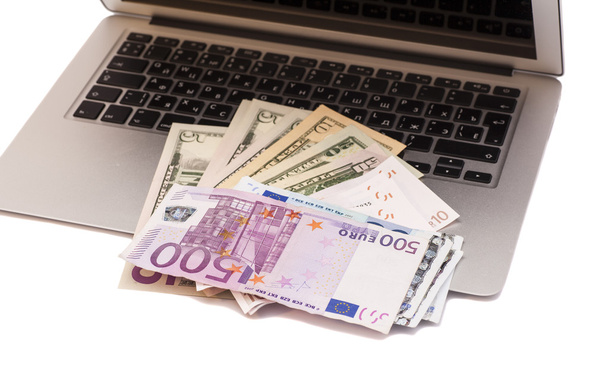 Open Laptop With Dollars And Euro money - Foto, afbeelding
