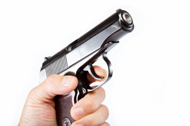 Gun in hand on a white background. - Photo, Image