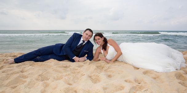 Bride and groom on the sand in love - Photo, Image
