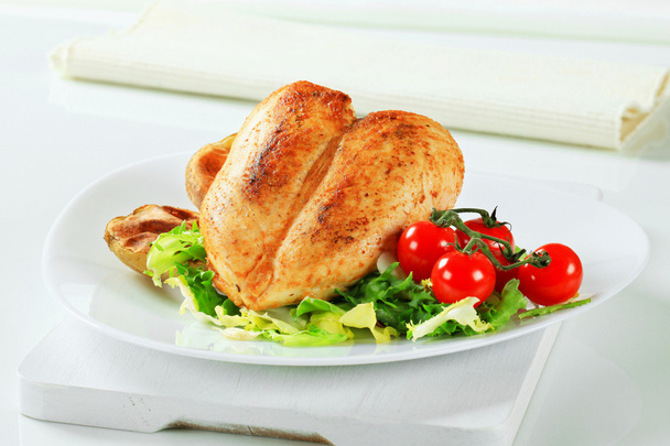 Roasted chicken breasts with potatoes and salad - Photo, Image