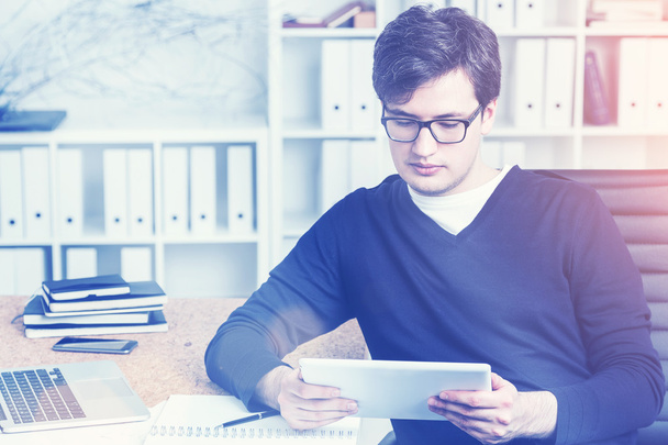 Accountant using tablet at work, toned - Фото, изображение