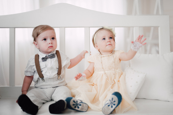 two babies wedding - boy and girl dressed as bride and groom - Фото, зображення