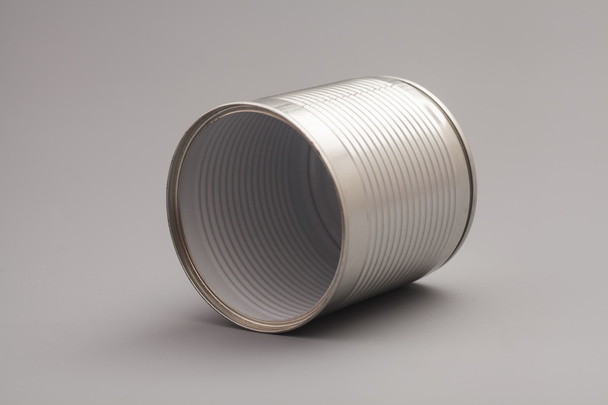 A silver tin can isolated on a gray background - Valokuva, kuva