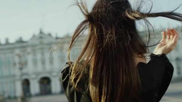 Beatiful young woman posing and touching her hair - Imágenes, Vídeo