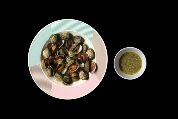 Steamed blanched clams with seafood dipping sauce. - Photo, Image