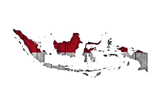 地図と風化した木のインドネシアの旗 - 写真・画像