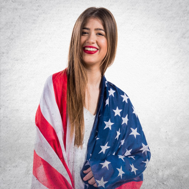 Girl holding an american flag - Фото, зображення