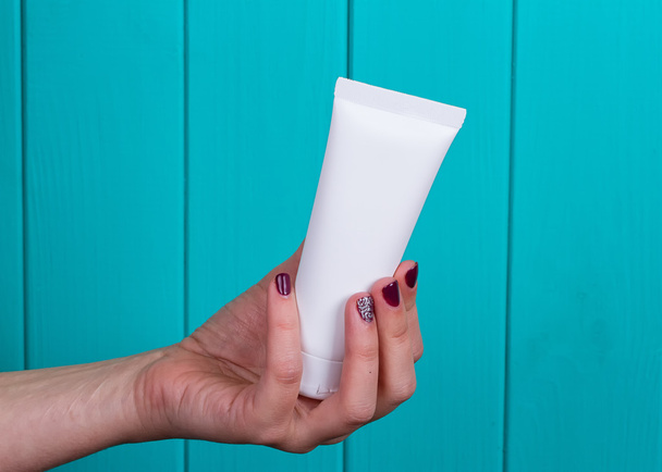 Woman's beautiful hands with care cream tube - Photo, Image