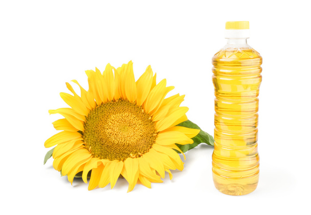 Sonnenblumenöl und Blume isoliert auf weiß - Foto, Bild