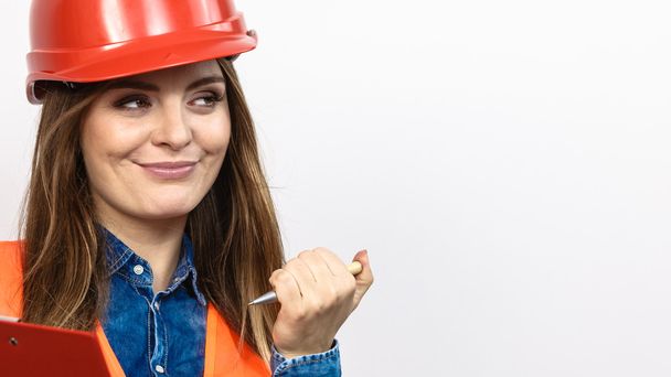 Woman engineer construction builder in helmet. - Φωτογραφία, εικόνα