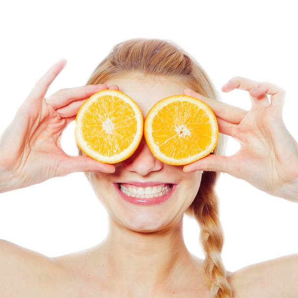 Young woman with oranges - Photo, Image