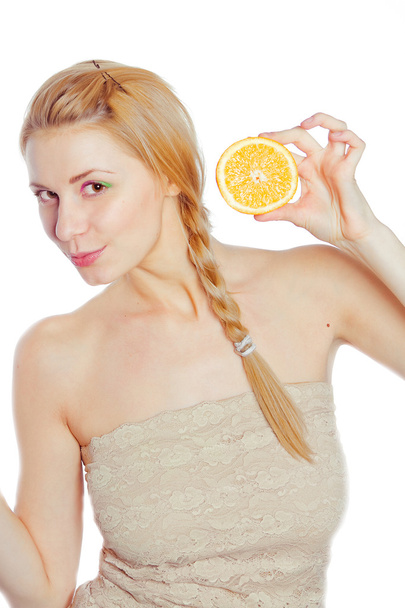 Young woman with oranges - Fotó, kép