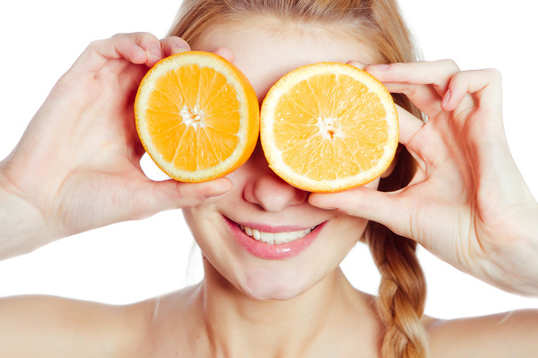 Young woman with oranges - Фото, зображення