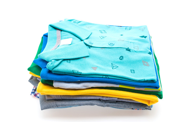 Stack of t shirts and polo shirts  - Photo, Image