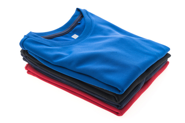 Stack of t shirts and polo shirts  - Photo, Image