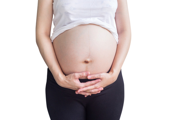 έγκυος γυναίκα που κρατώντας την κοιλιά σε απομονωμένες λευκό με τον pat αποκοπής - Φωτογραφία, εικόνα