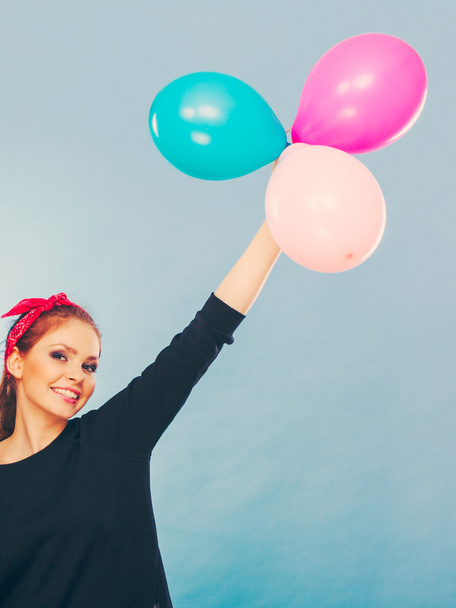 Lovely smiling girl holds colorful balloons. - Foto, Imagem