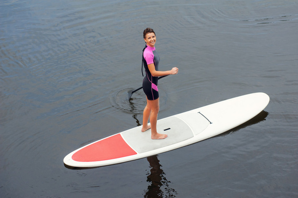 SUP Stand up paddle board woman paddleboarding - Foto, Imagen