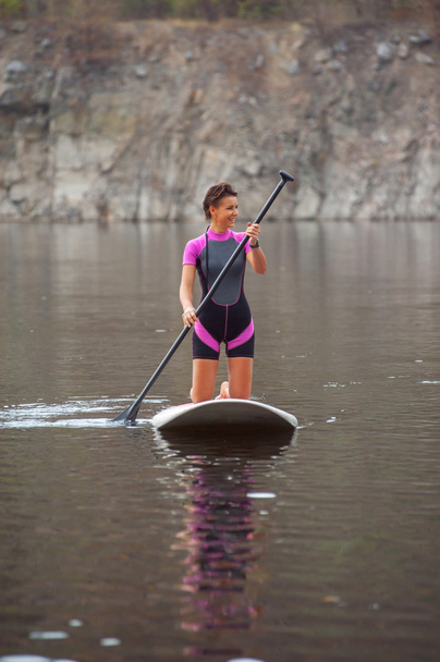 SUP Stand up paddle board woman paddleboarding - 写真・画像