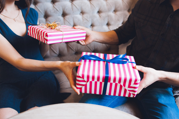 Couple giving gifts for each other - Photo, image