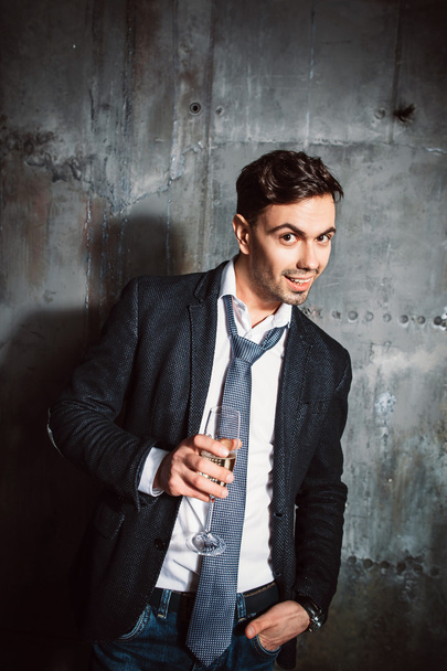 Friendly smiling man with champagne glass - 写真・画像