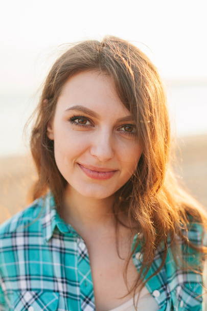 Outdoor portrait, young beautiful woman smiling - Фото, изображение