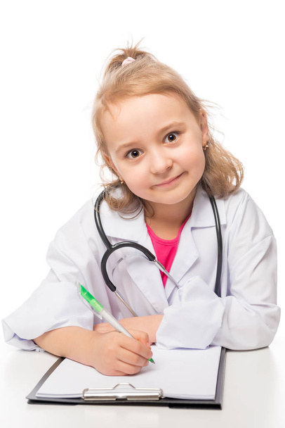 Child preschooler in doctor costume, playing in the medical prof - Photo, Image