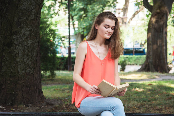 Young woman with book - Foto, imagen