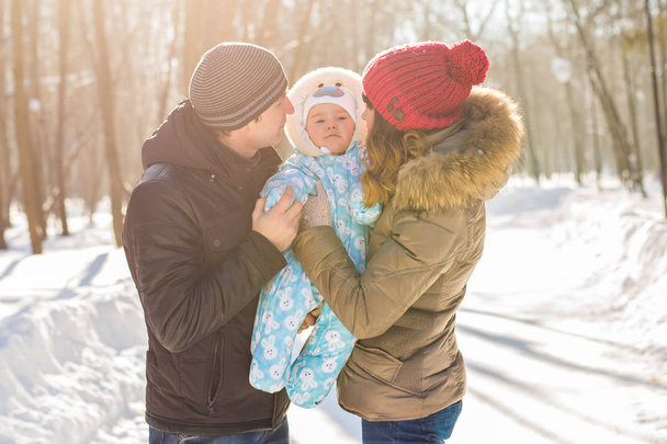 Happy family - Mother, father and child boy on a winter walk. - Valokuva, kuva