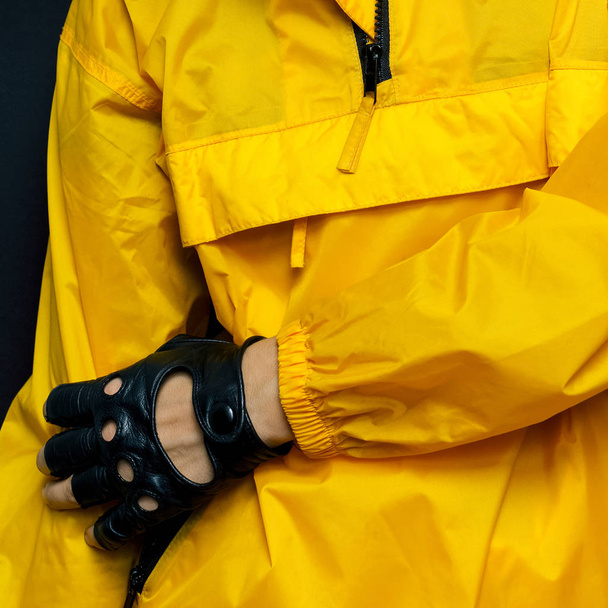 Trend accessory gloves and bright orange jacket. Details fashion - Фото, зображення