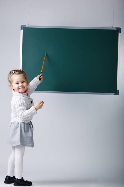 cute little girl with blackboard - Фото, зображення