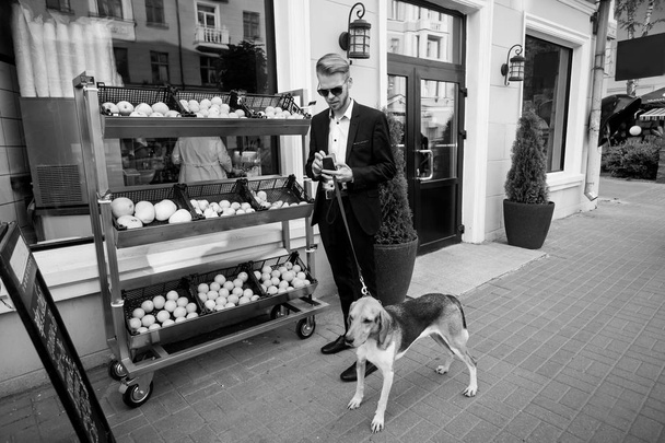 young man with dog - Valokuva, kuva