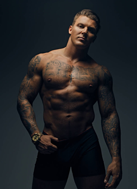Tattooed muscular male - 写真・画像
