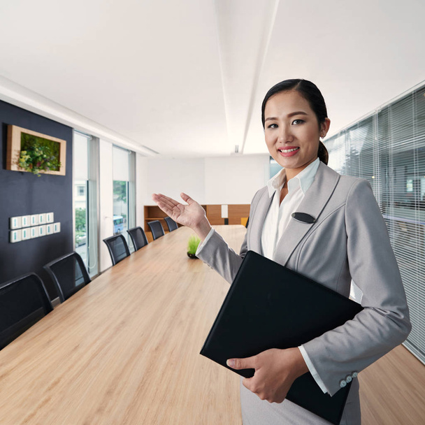 business lady showing you office room - Photo, Image