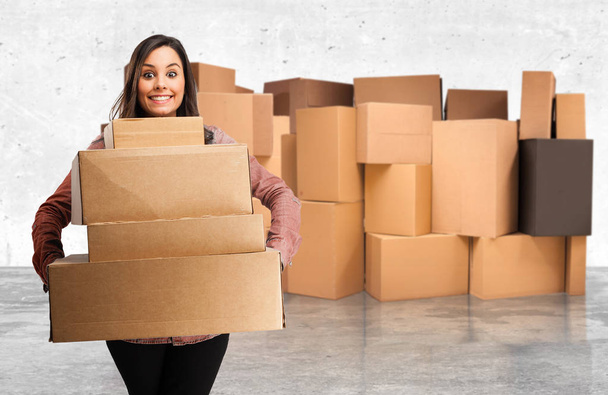 happy young woman with boxes - Фото, изображение