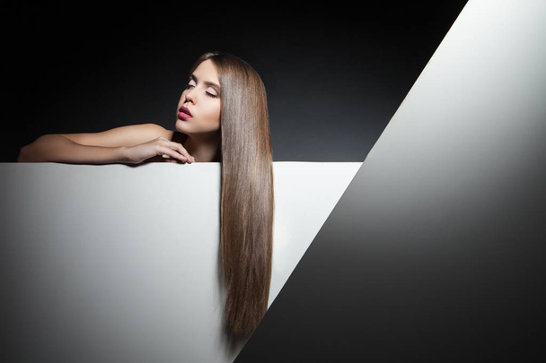 Beautiful brunette with long hair and eyes closed - Valokuva, kuva