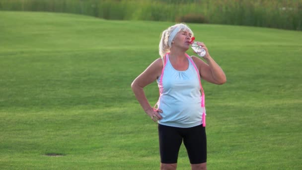 Senior woman with sports bottle. - Footage, Video